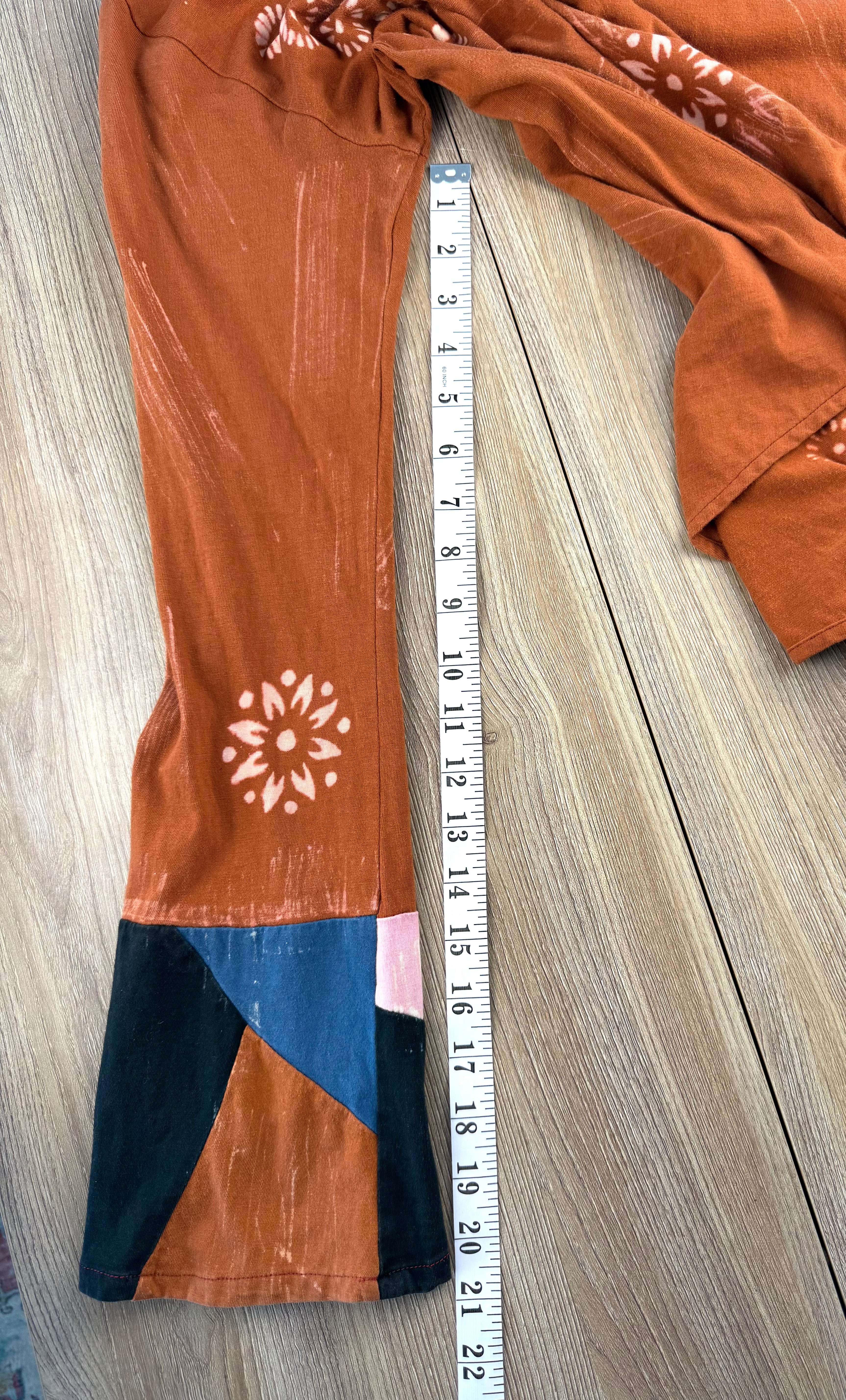 Tye dye boho artsy unique asymmetrical top in burnt orange  measuring 21" sleeve length