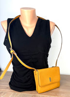 Vegan Leather Accessorize Mustard Yellow Crossbody Bag on mannequin to show size