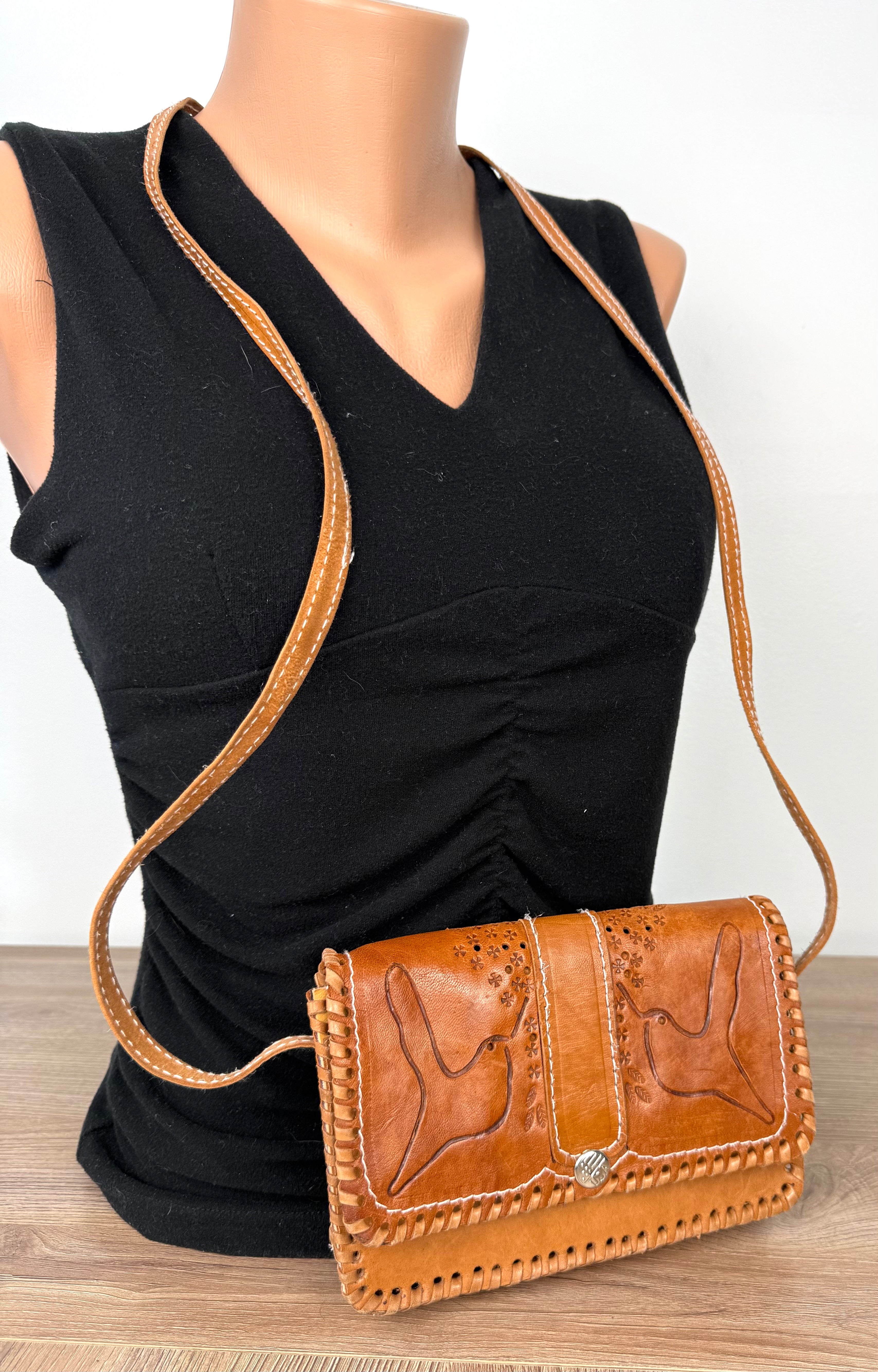 Vintage Hand-Tooled Leather Crossbody Bag at Blue Sparrow Shop on mannequin to show size