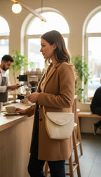 Vintage Leather Joop Crossbody Bag  at Blue Sparrow Shop on woman standing at cafe 