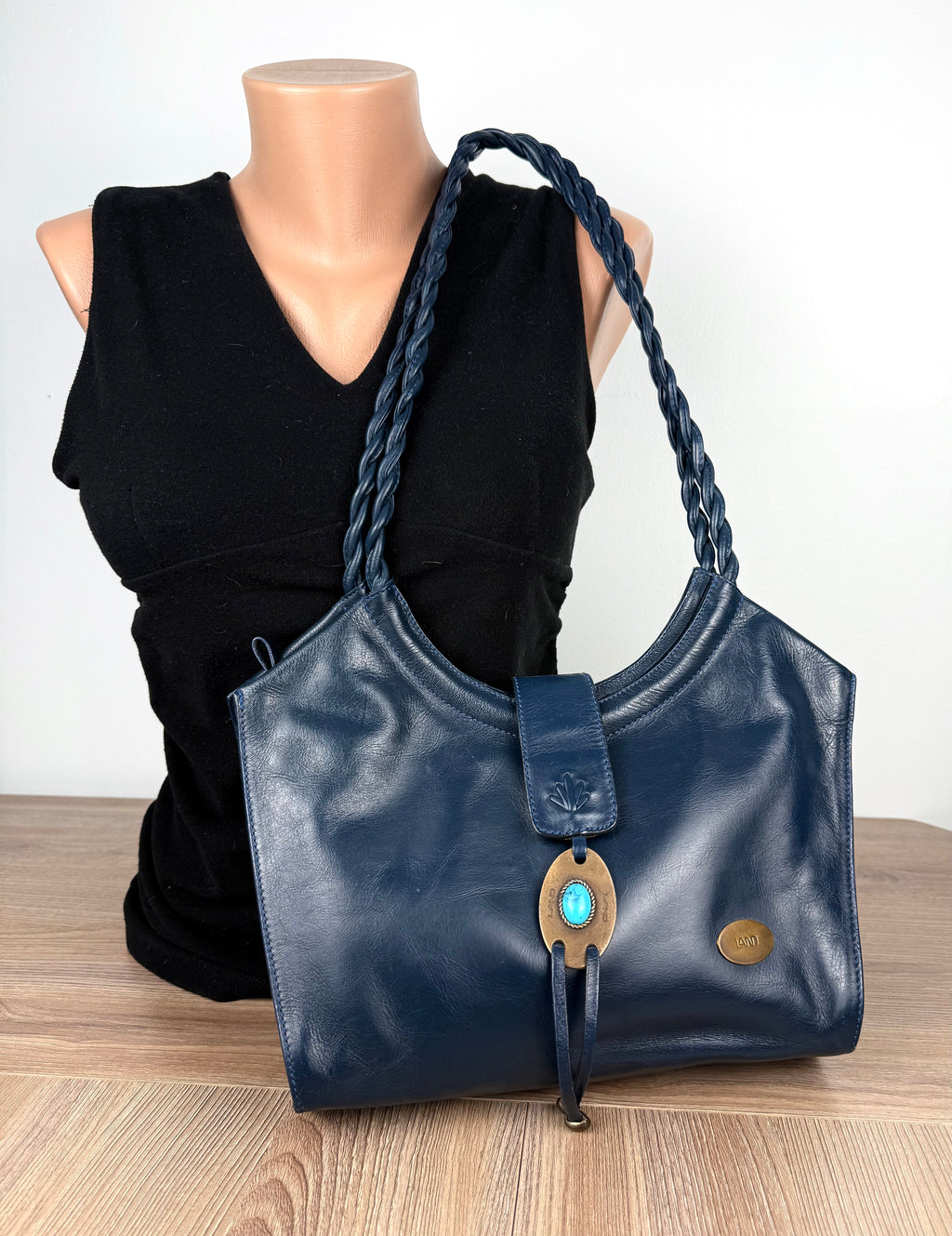 Vintage Leather Purse by LAND on mannequin to show scale 