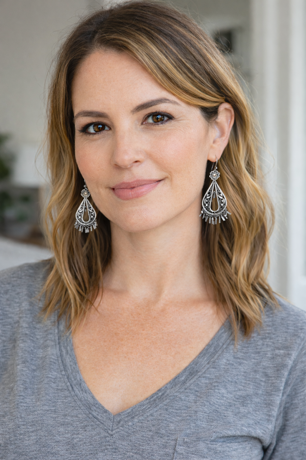 Vintage Style Filigree Dangle Earrings at Blue Sparrow Shop on model 