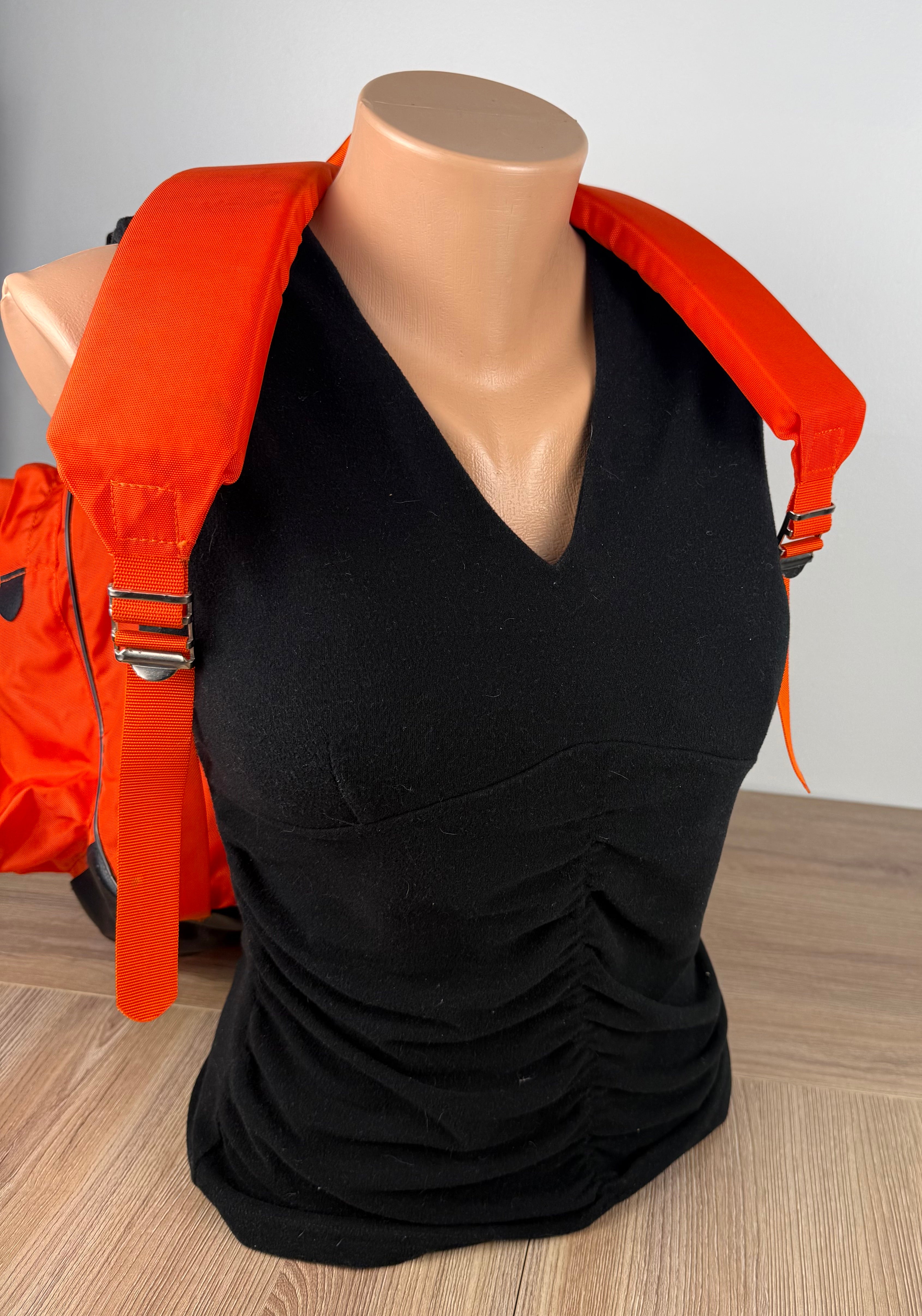 Vintage World Famous Hiking Backpack showing straps on front of mannequin for scale 