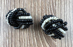Vintage black and white beaded knot earrings retro seed bead jewellery on desk