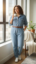 Vintage looking Mechanic Style Denim Coveralls at Blue Sparrow Shop on woman looking out window drinking coffee