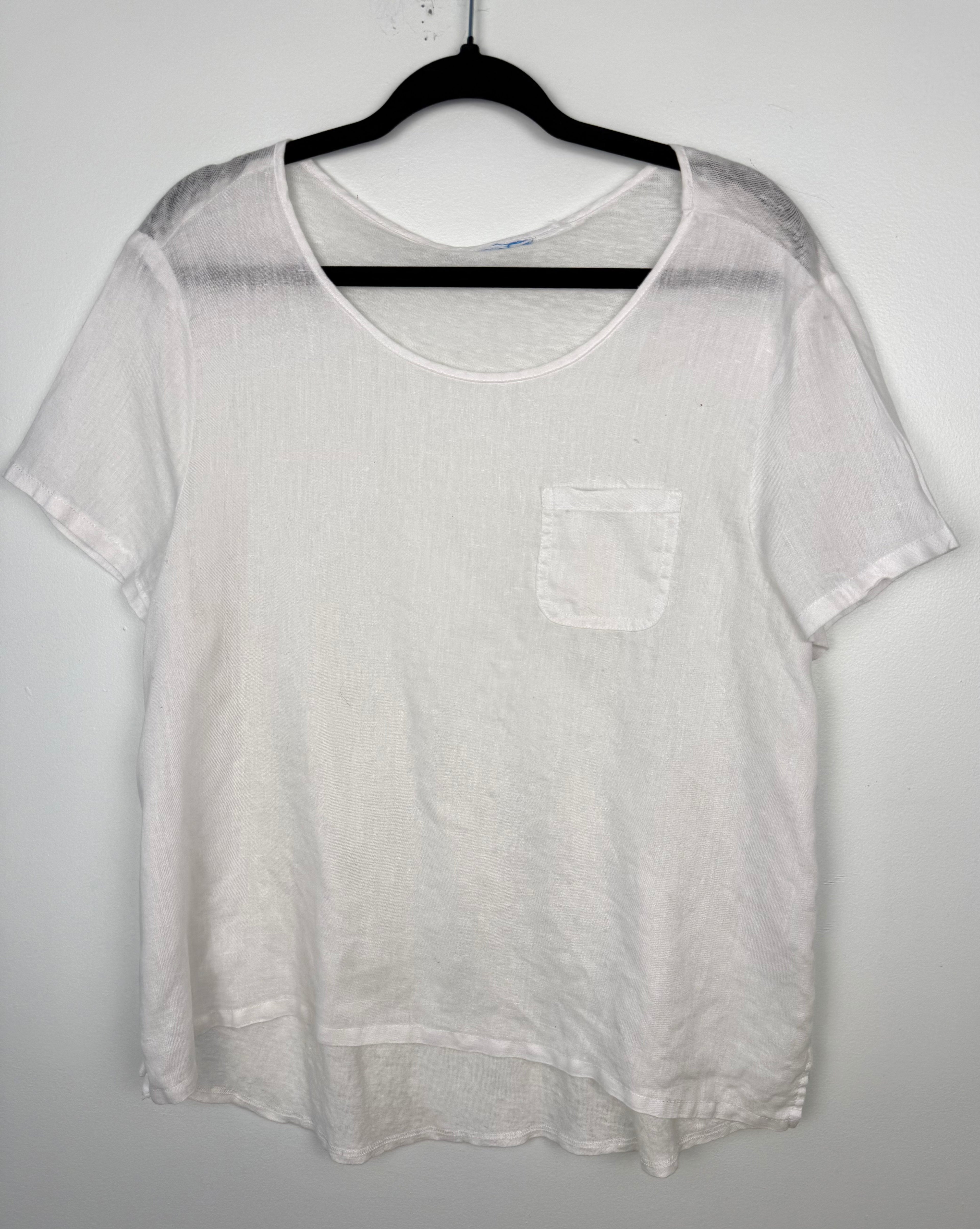 White linen blend basic, boxy, short sleeve tee with chest pocket at Blue Sparrow Shop front of top on hanger