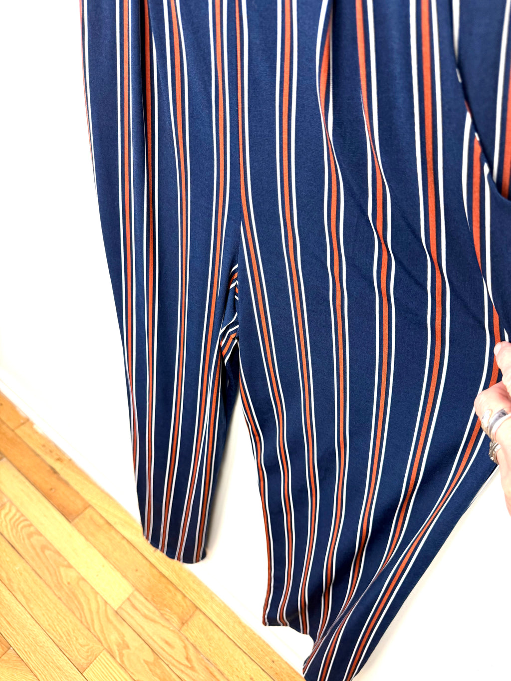 Wide leg striped jumpsuit women front view of legs close up