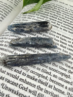 Blue /Black stones on a book with text