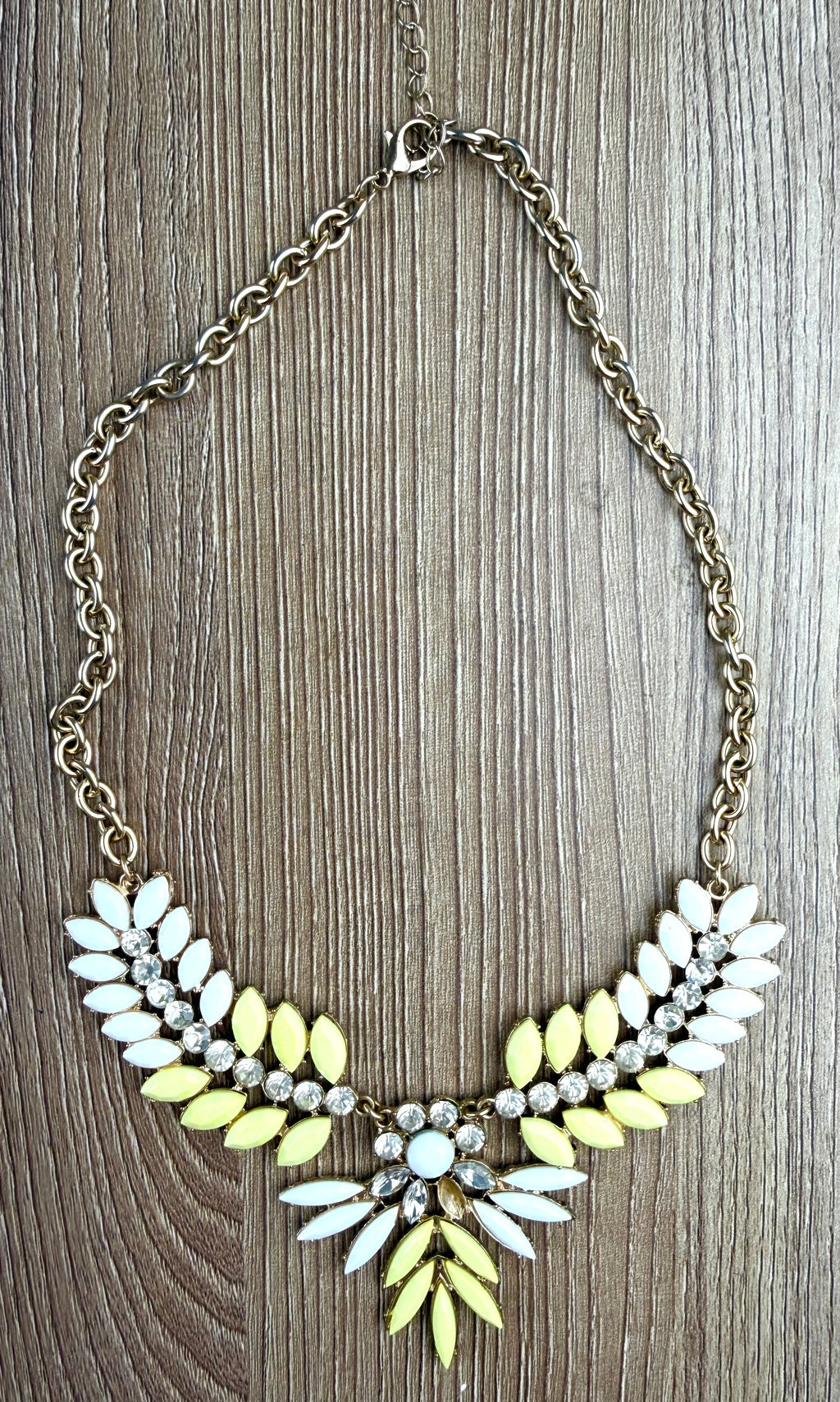 Yellow & White Marquise Floral Statement Necklace on table 