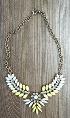 Yellow & White Marquise Floral Statement Necklace on table 