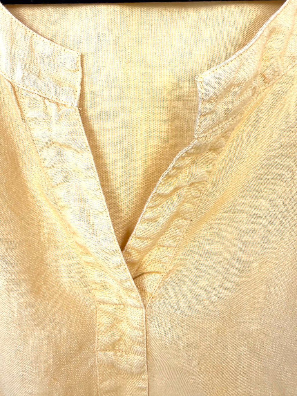 Yellow linen blouse breathable travel outfit European summer style neckline 