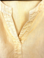 Yellow linen blouse breathable travel outfit European summer style neckline 