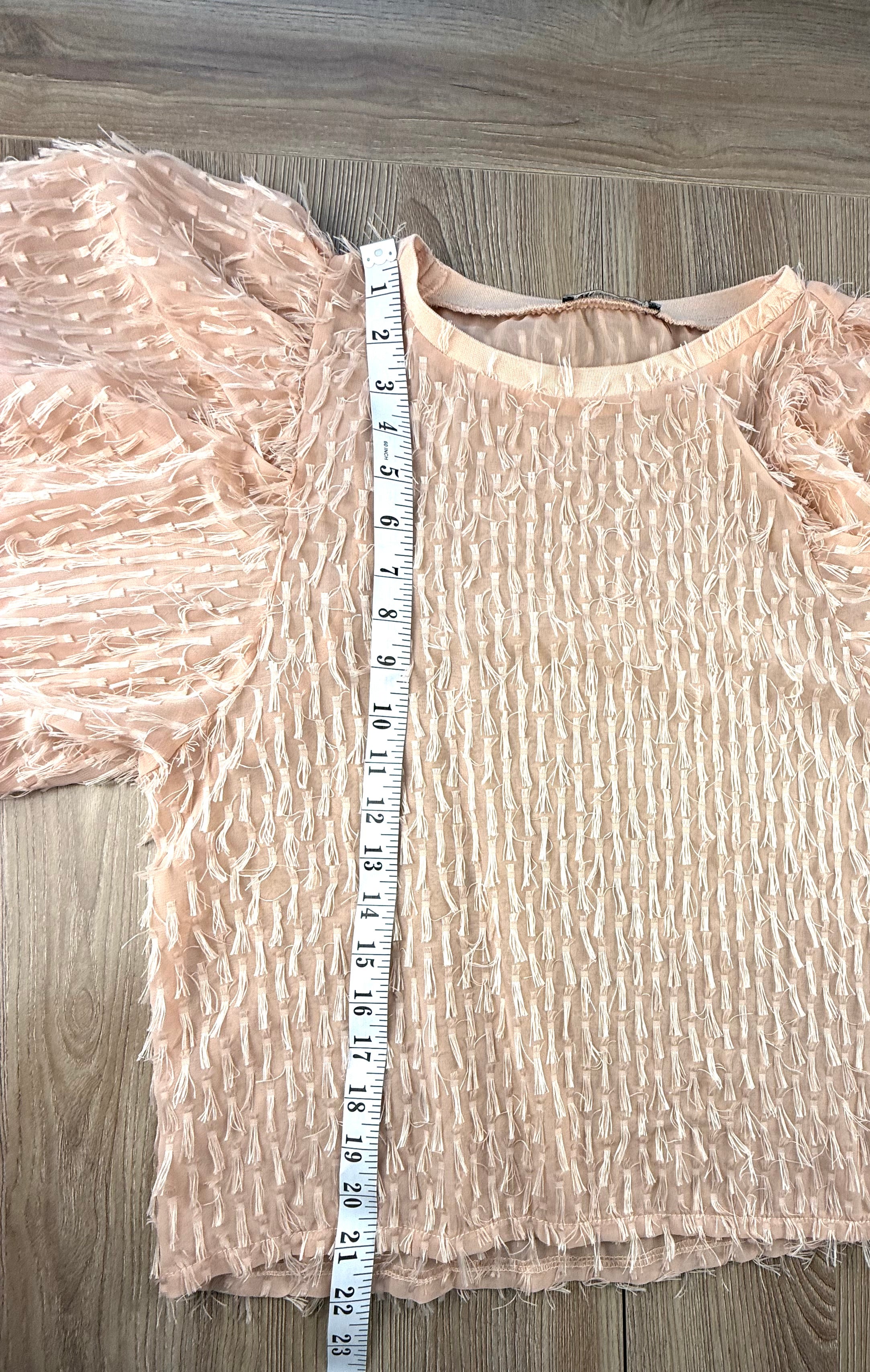 Zara feathery top measuring 21" from shoulder to hem 