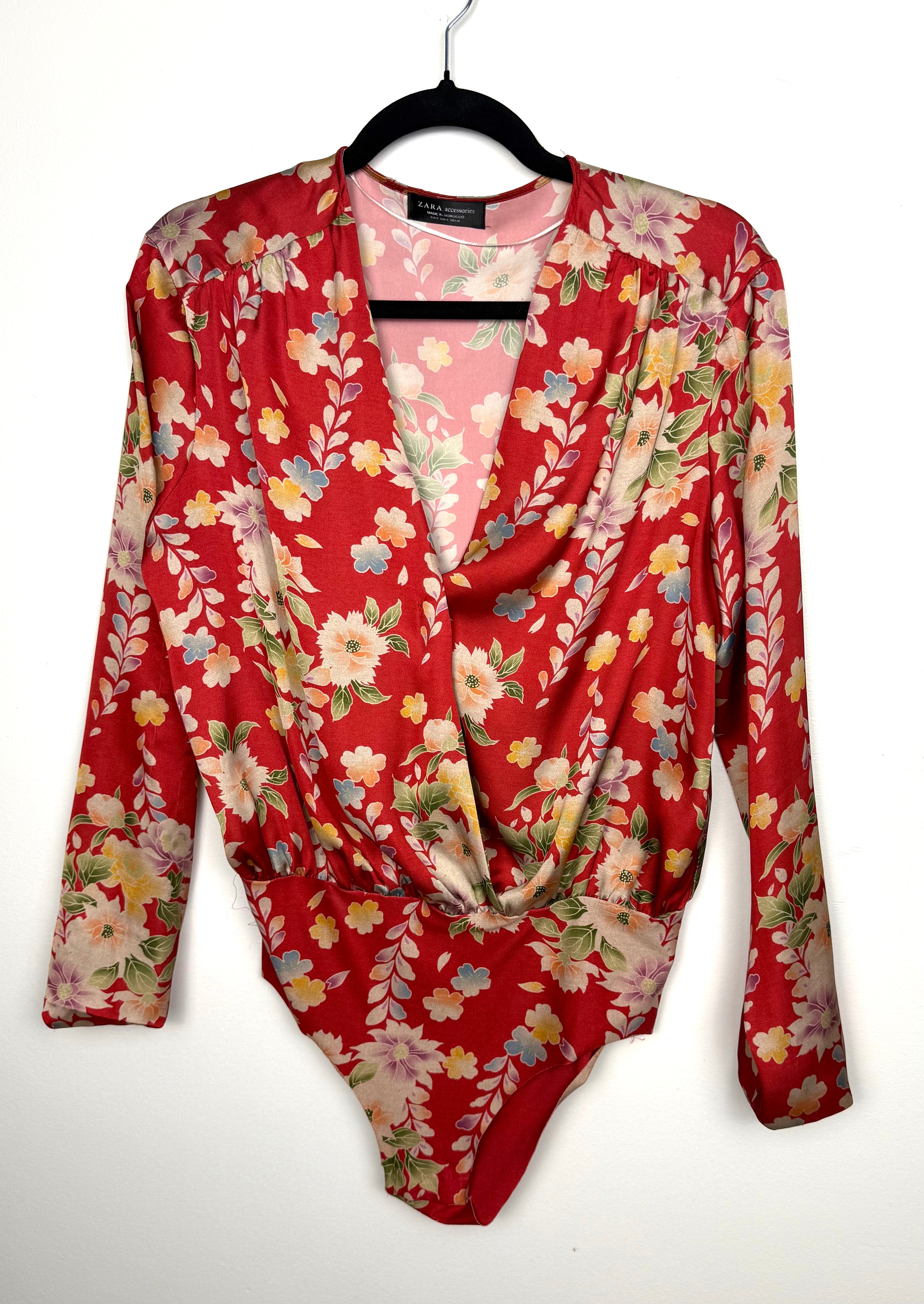 Zara red floral long sleeve wrap bodysuit with deep V neckline and snap closure, size small, multi colour flower print blouse top for women.