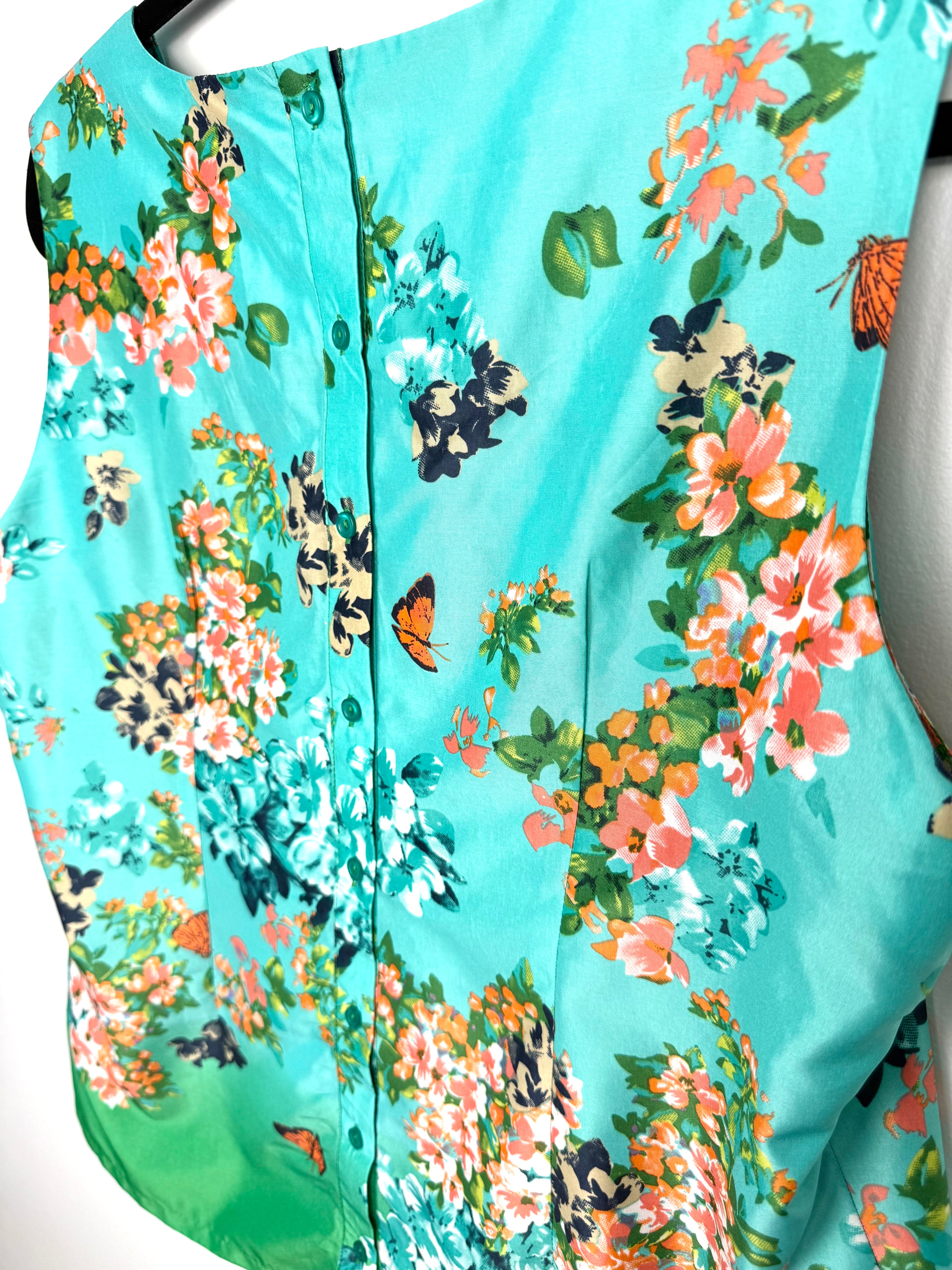 back button detailing on butterfly patterned blouse by Linea Domani 