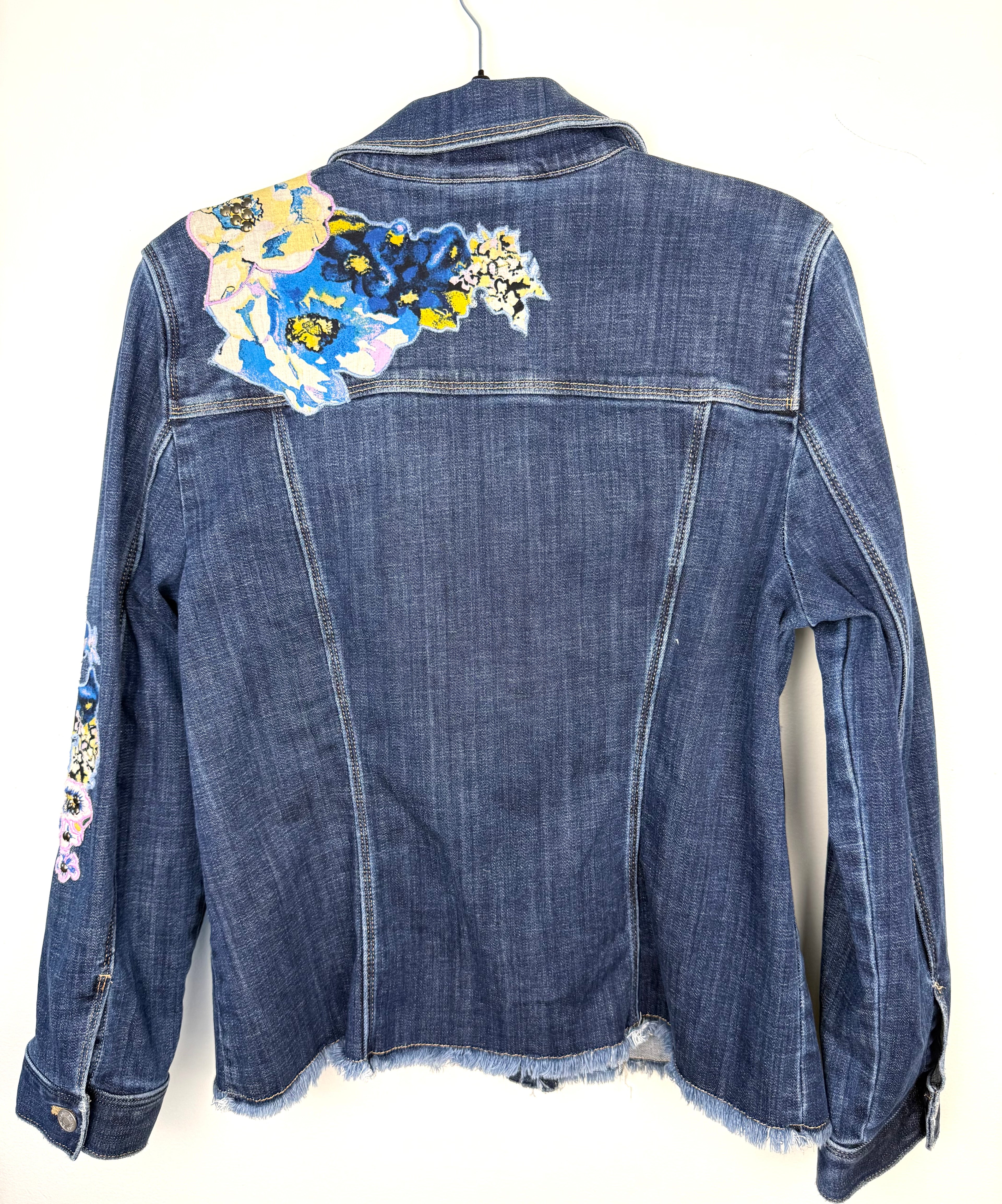 back decal detail on Chicos embroidered denim jacket 