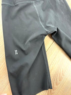 back leg of Kit and Ace black high-waist biker shorts  showing logo 