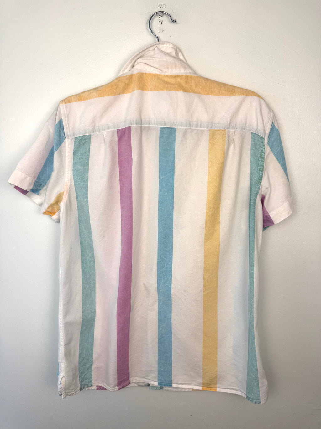 back of AMERICAN EAGLE 100% COTTON PASTEL STRIPE SHIRT at Blue Sparrow Canadian Resale Reimagined on hanger