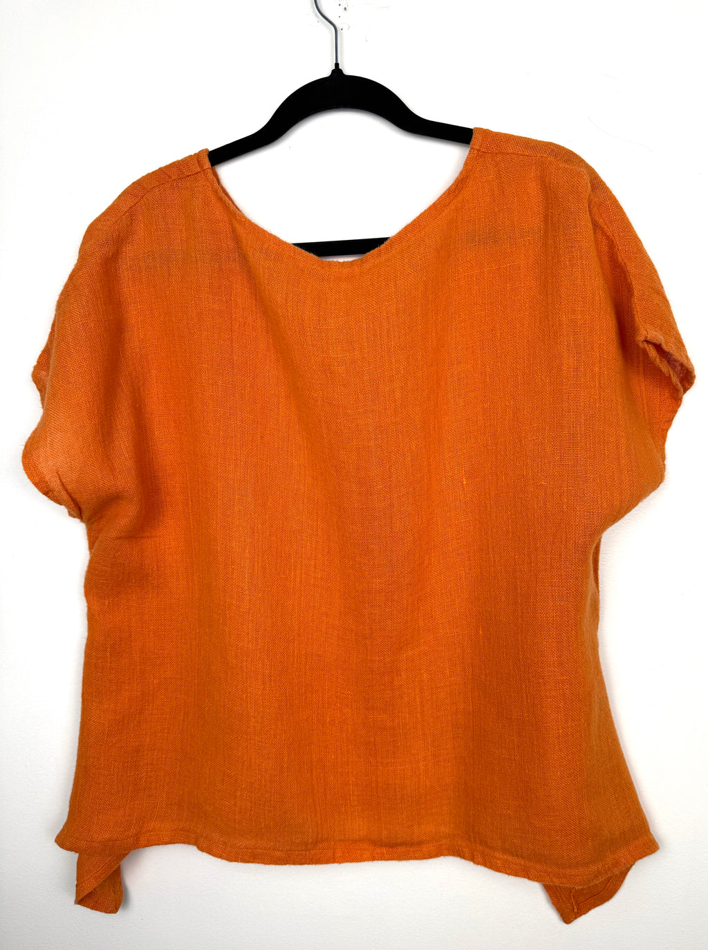 back of Burnt orange cotton short sleeved oversized top at Blue Sparrow Shop  on hanger