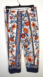 back of Casual boho patterned wide leg pants in orange and blue  on hanger