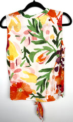 back of Cleo tie-front V-neck floral blouse in bold painterly orange red and green botanical print on hanger