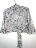 back of Cropped Chiffon Bolero Jacket on hanger