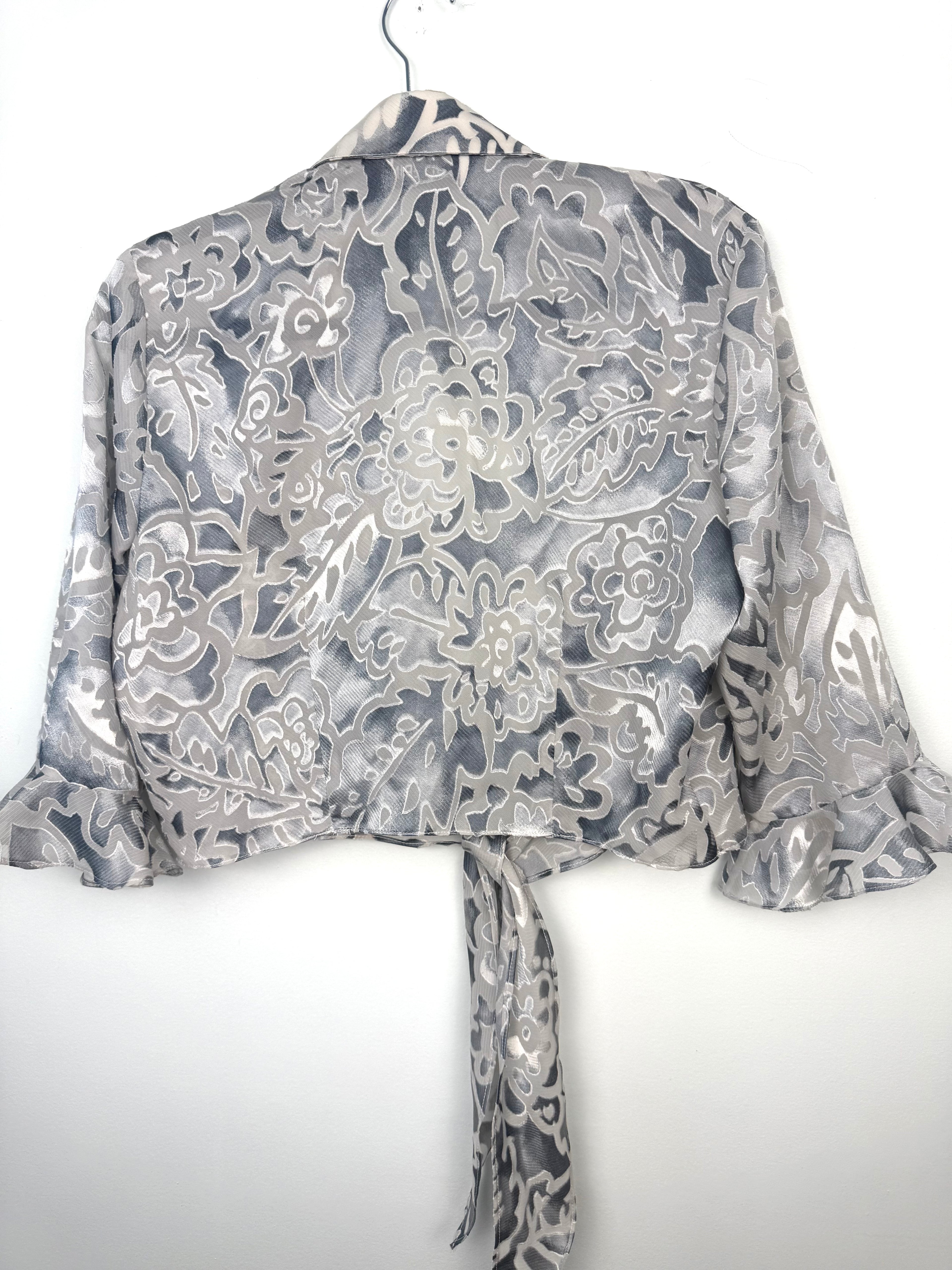 back of Cropped Chiffon Bolero Jacket on hanger
