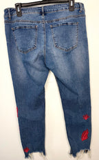 back of Dex embroidered feather skinny jeans medium wash distressed raw hem at Blue Sparrow Shop 
