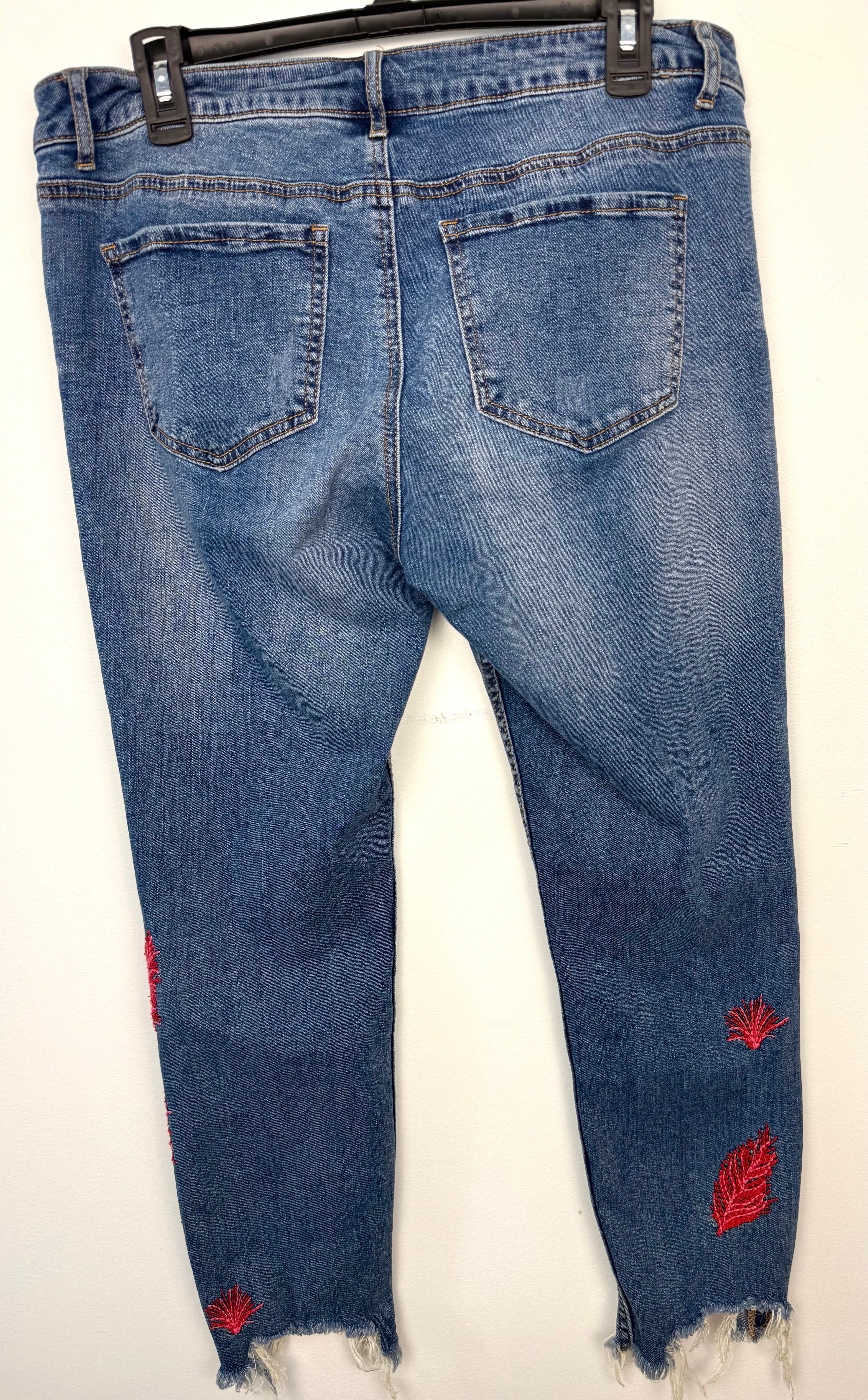 back of Dex embroidered feather skinny jeans medium wash distressed raw hem at Blue Sparrow Shop 