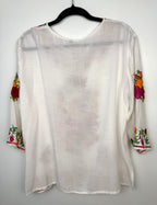 back of Embroidered Floral Tunic Blouse on hanger
