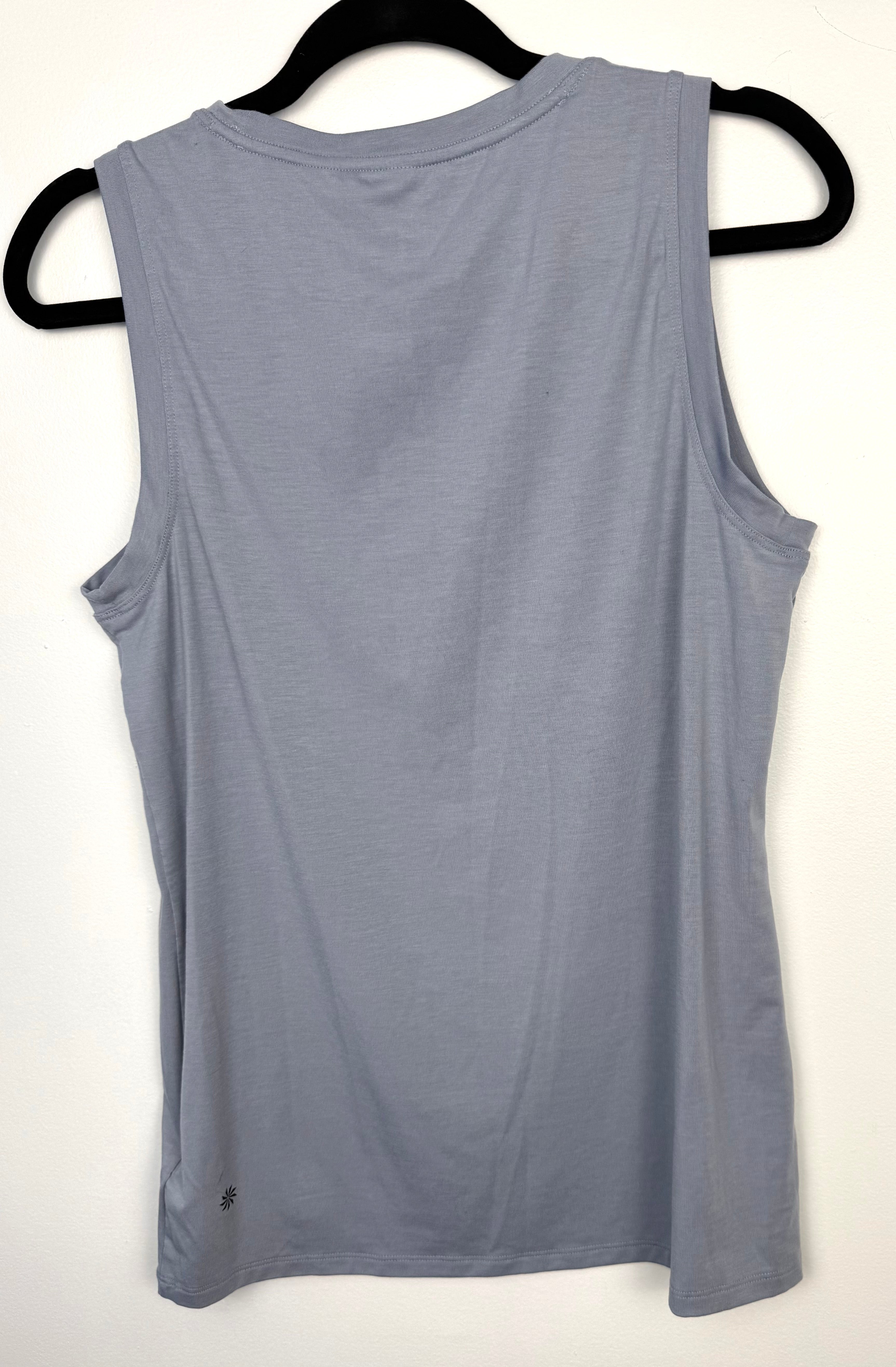 back of Grey Athleta Vital Tank 2.0 sleeveless top, lightweight performance fabric, minimalist athletic layering piece on hanger