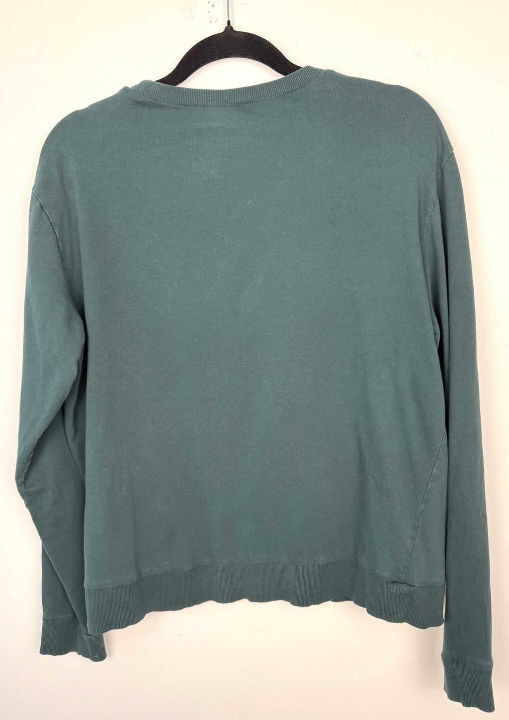 back of H&M Divided teal green 100% cotton graphic crew neck sweatshirt with "Property of No One" distressed white lettering, front view on hanger — Blue Sparrow pre-loved women's fashion
