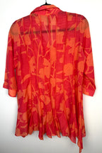 back of IC by Connie K Silk Blend Blouse in coral and orange on hanger