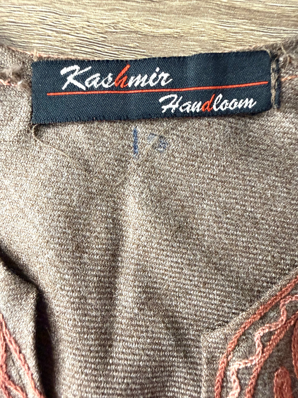 back of Kashmir Handloom Embroidered Poncho Boho Handloom Cape inside label