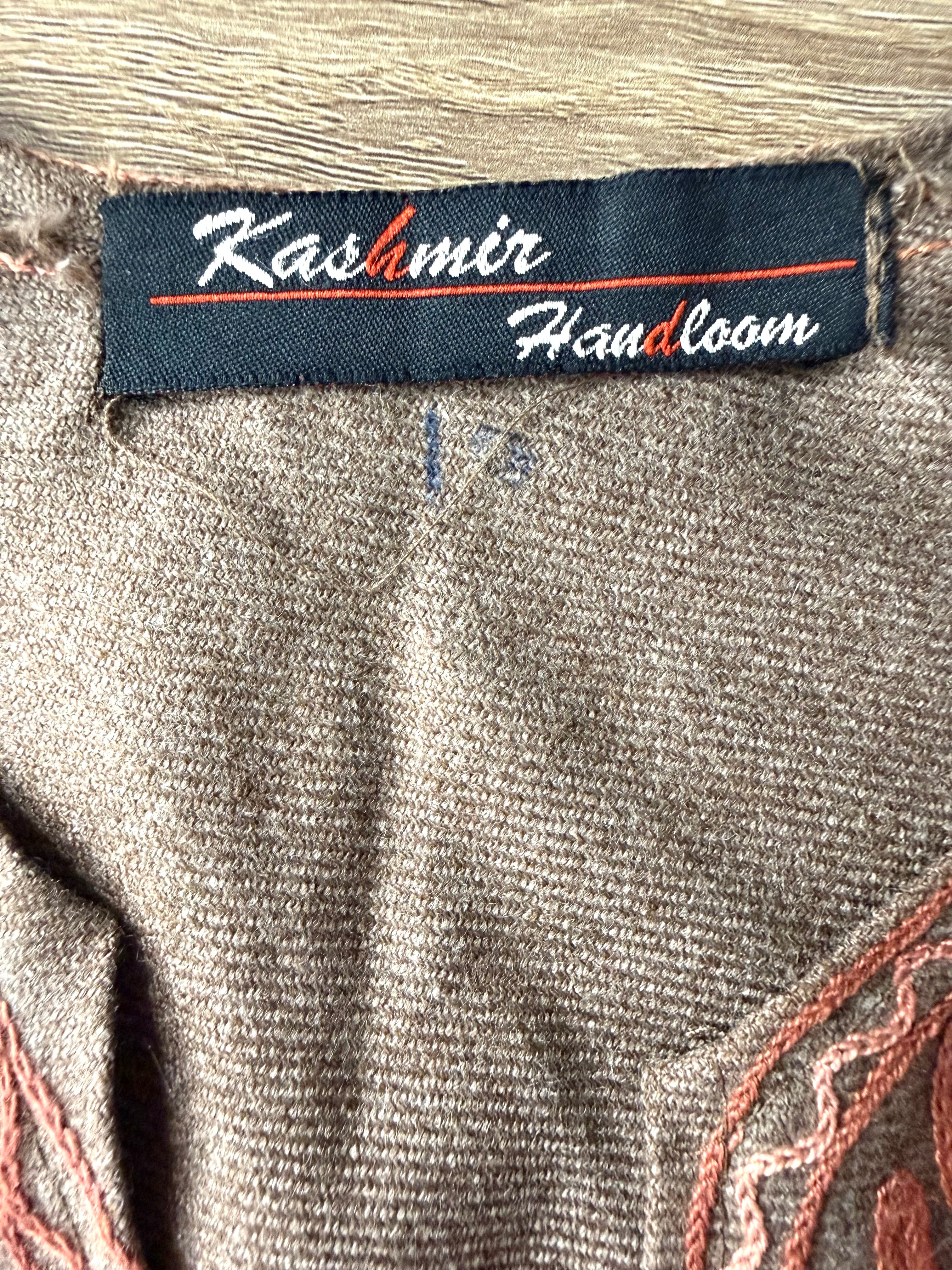 back of Kashmir Handloom Embroidered Poncho Boho Handloom Cape inside label