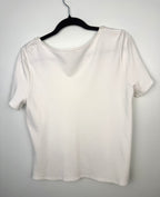 back of Laura Petites  Pearl Neckline Top on hanger