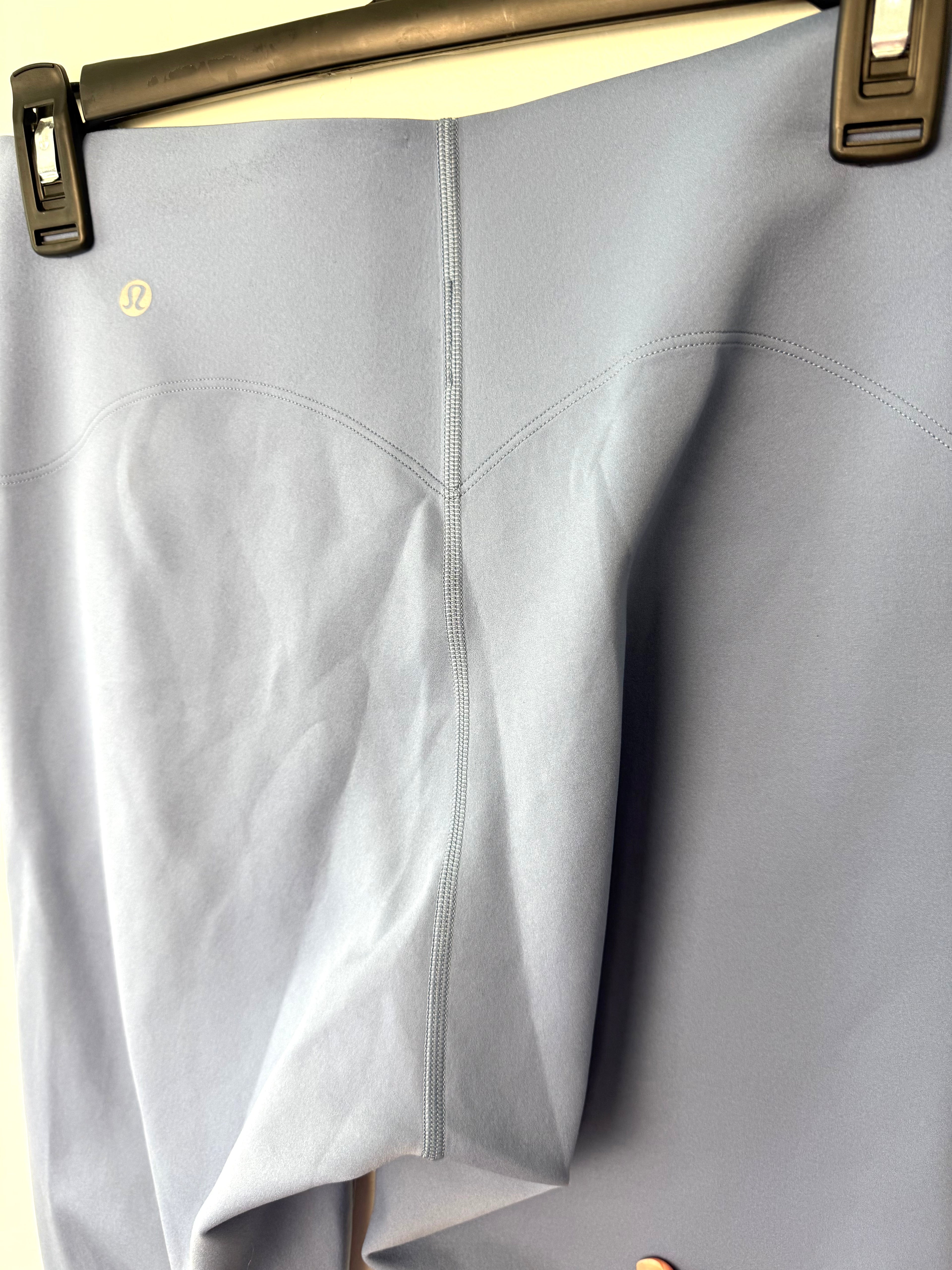 back of Lululemon High-Rise Performance Leggings | Size 8 at Blue Sparrow Shop on hanger