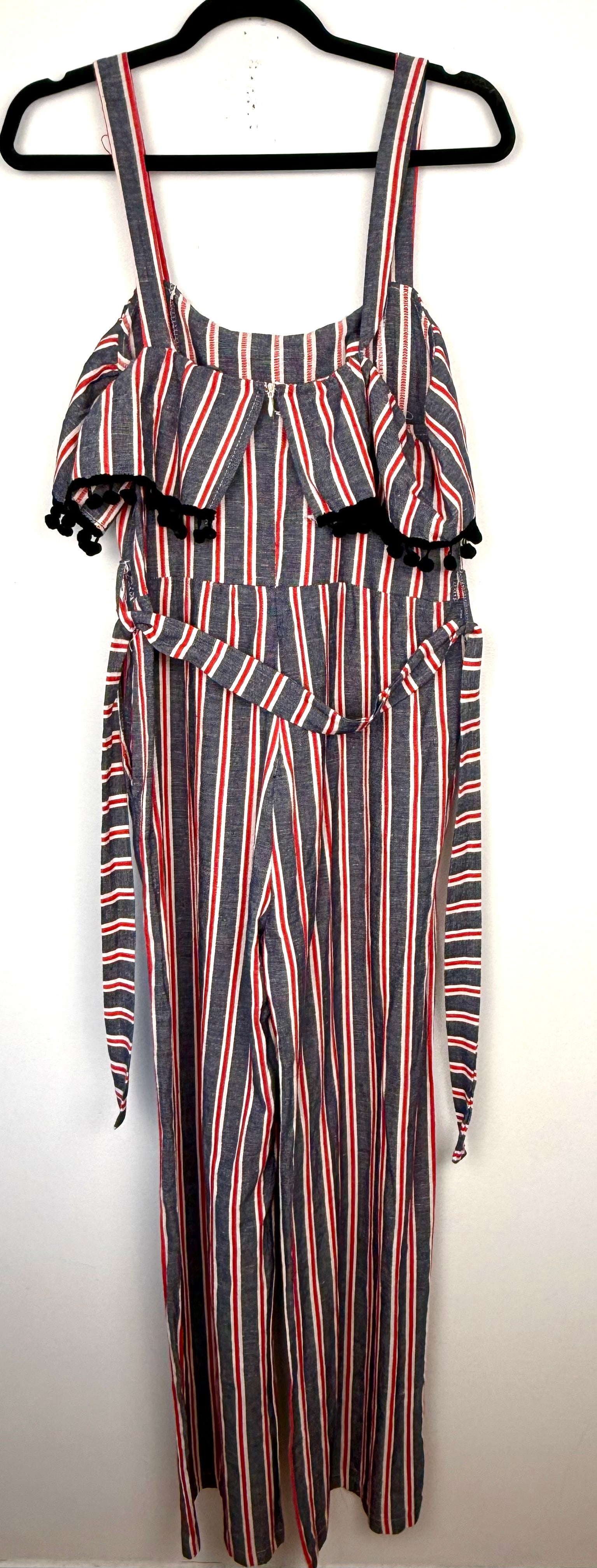 back of Made in Italy Cotton Linen Stripe Wide-Leg Jumpsuit — Denim Blue, Red & White | Pom-Pom Trim | Size M at Blue Sparrow Shop  on hanger