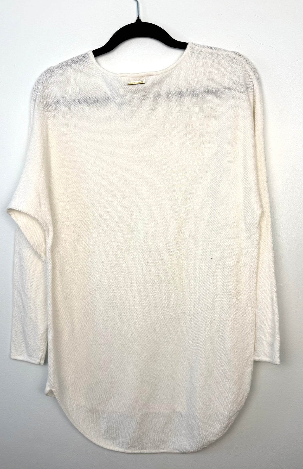 back of Michael Kors Tunic Sweater on hanger