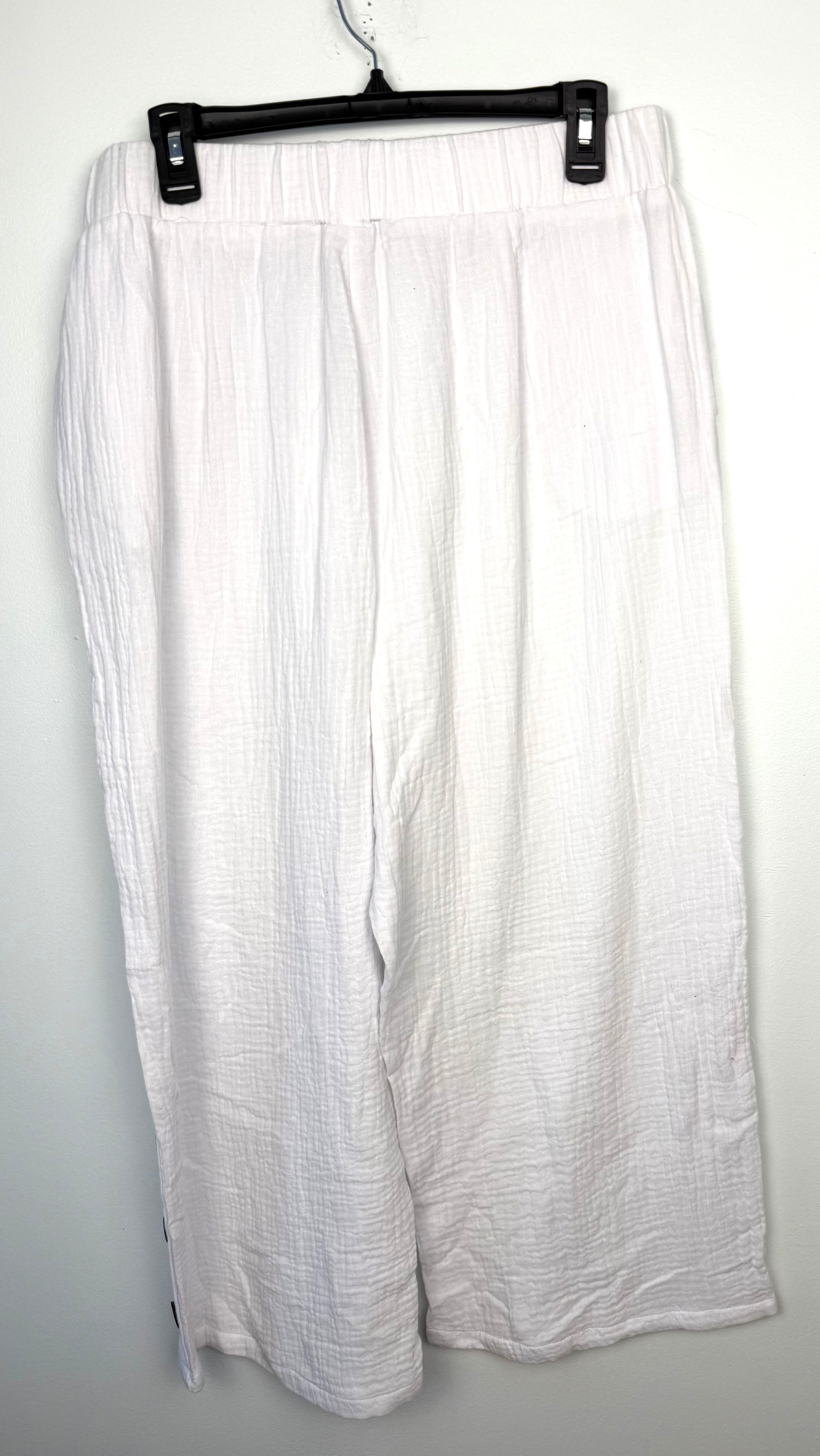 back of NWT Creation 100% Cotton Gauze Wide-Leg Pants — White | Button Hem Detail | Size XL at Blue Sparrow Shop on hanger