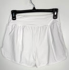 back of NWT white swim trunks size small compare at 79.99 at Blue Sparrow Resale Shop  on hanger
