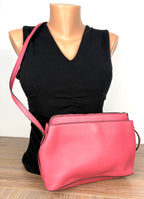 back of Nanette Lepore Pink Pebbled Leather Crossbody Bag at Blue Sparrow Shop on mannequin to show size 