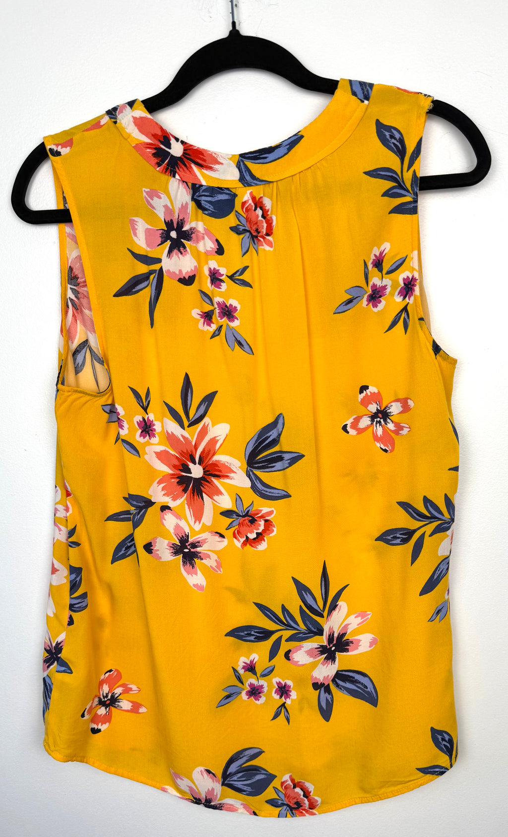 back of Old Navy Floral Sleeveless V-Neck Blouse — Golden Yellow | Coral and Navy Print | Size L at Blue Sparrow Shop on hanger