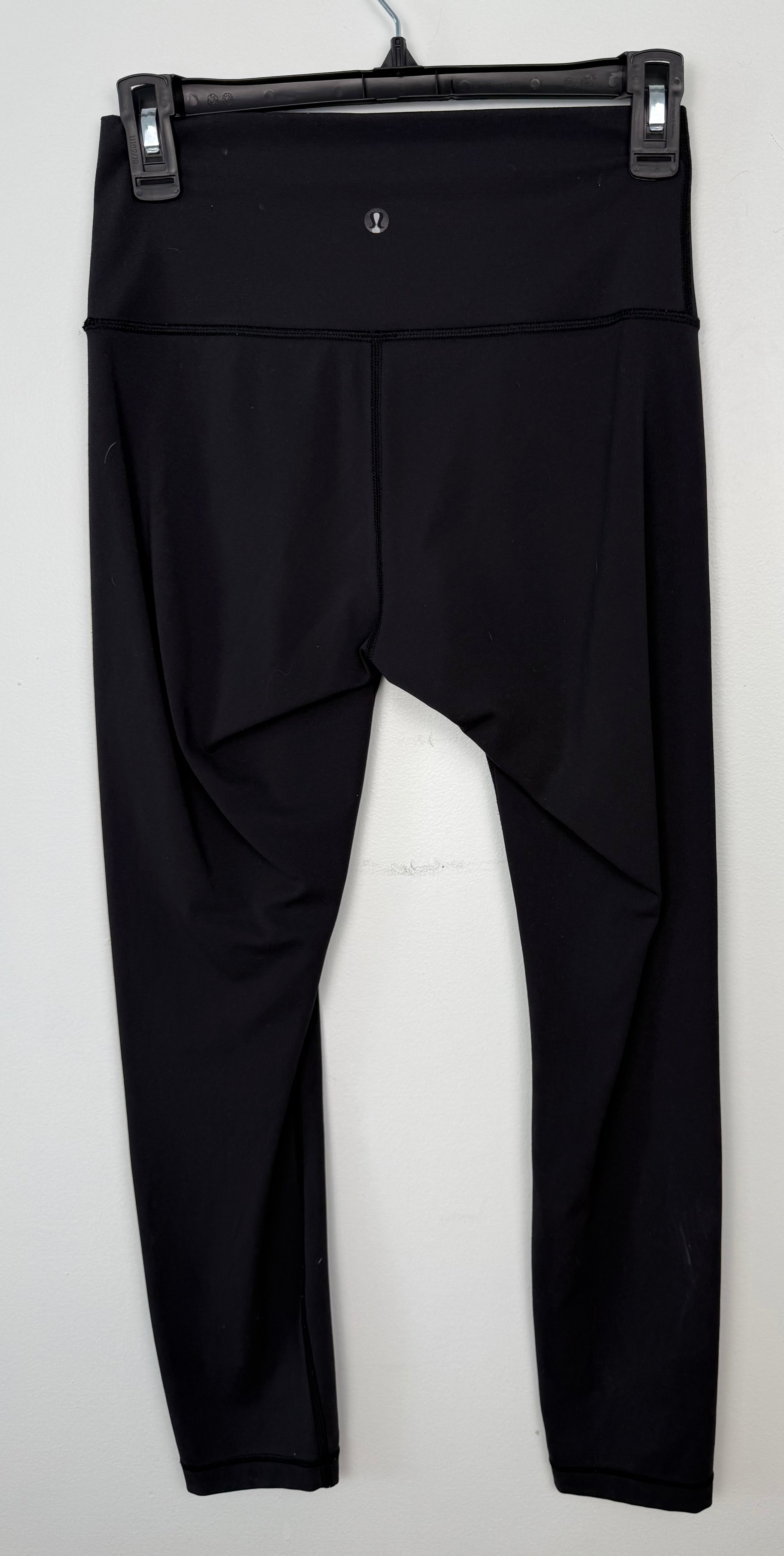 back of Pre-loved Lululemon Black High Waisted Leggings | Size 6 at Blue Sparrow Shop on hanger