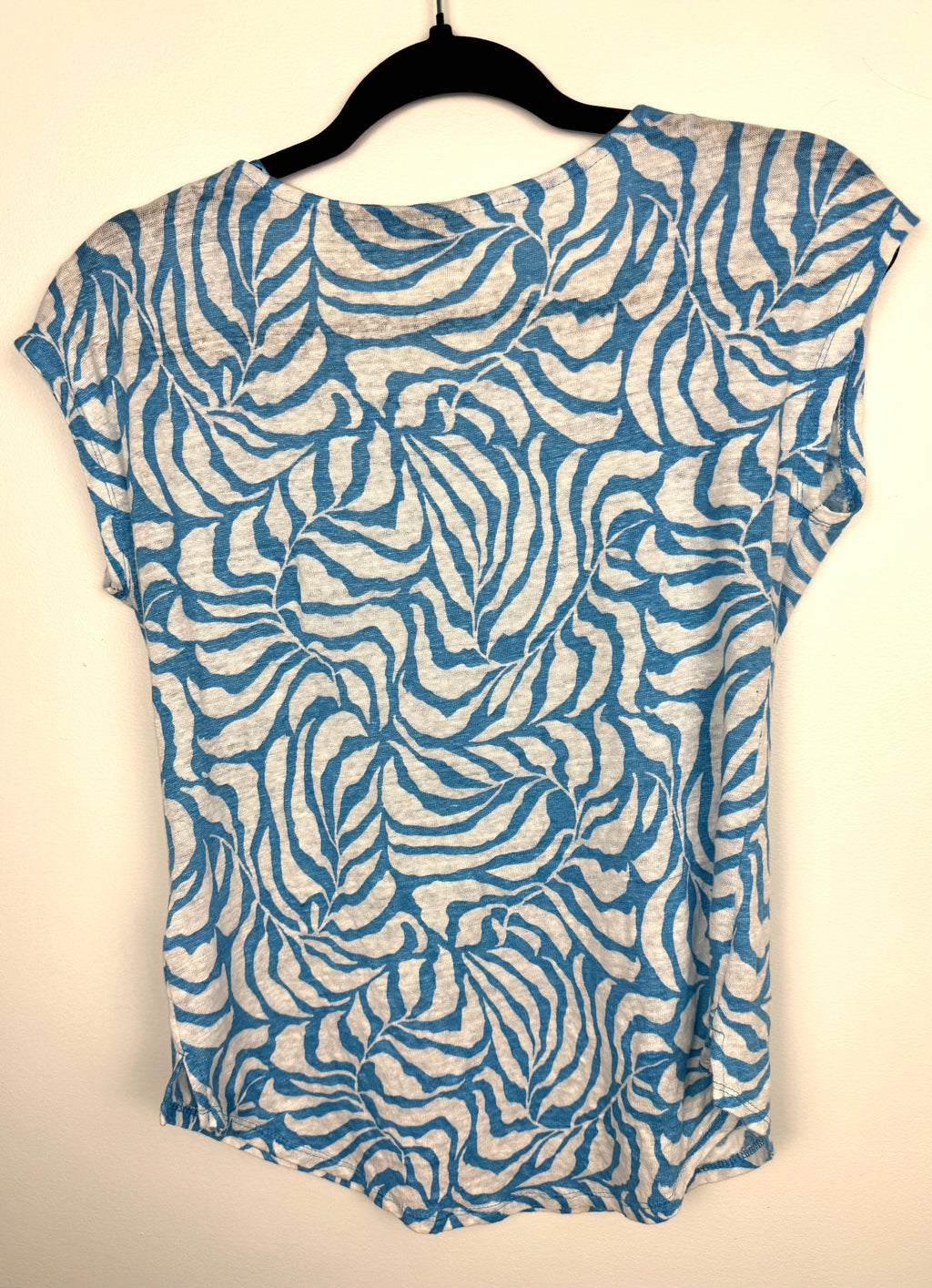 back of Tahari 100% linen botanical print top on hanger