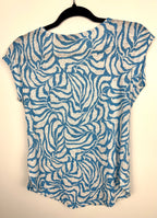 back of Tahari 100% linen botanical print top on hanger