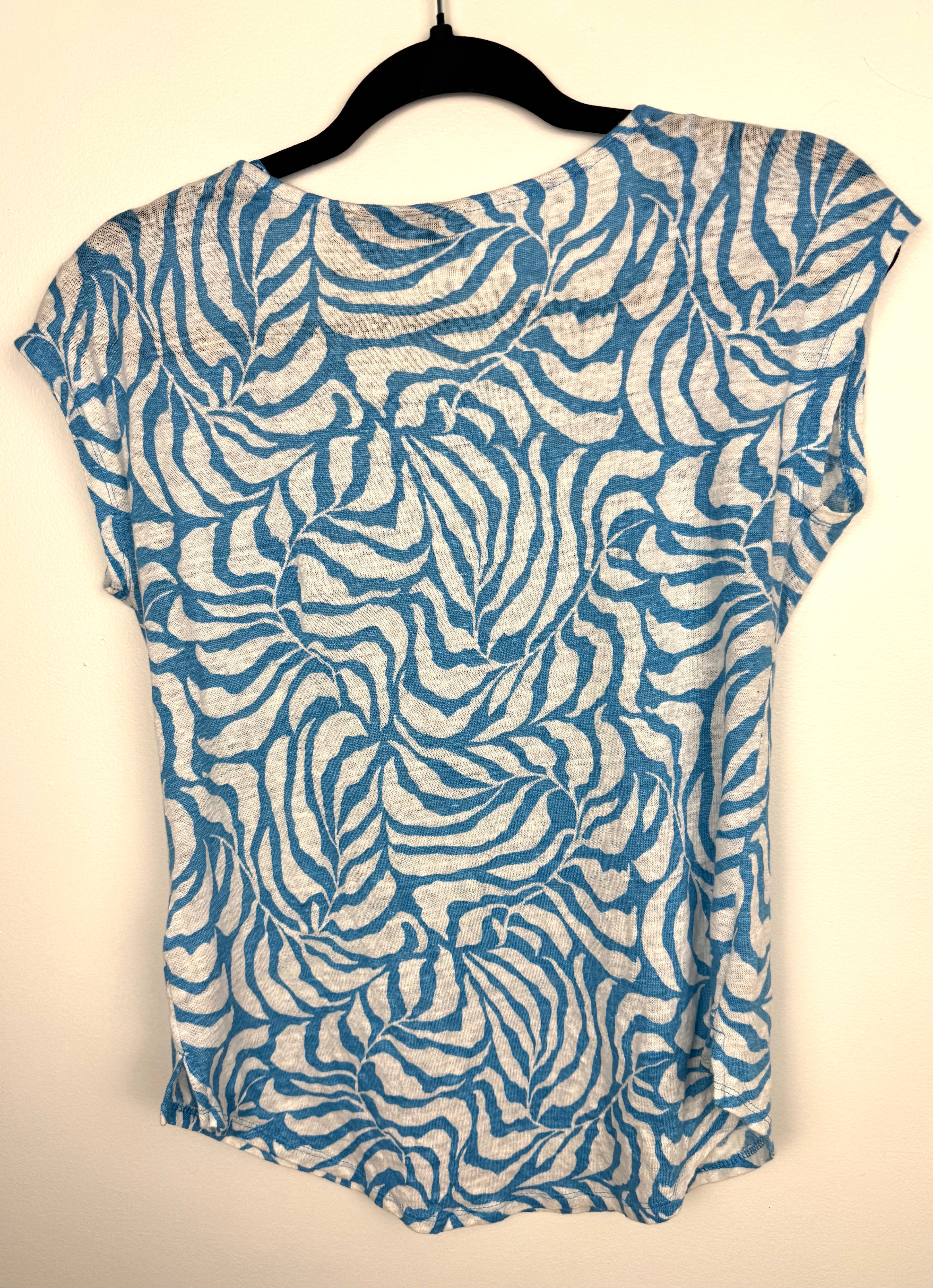 back of Tahari 100% linen botanical print top on hanger