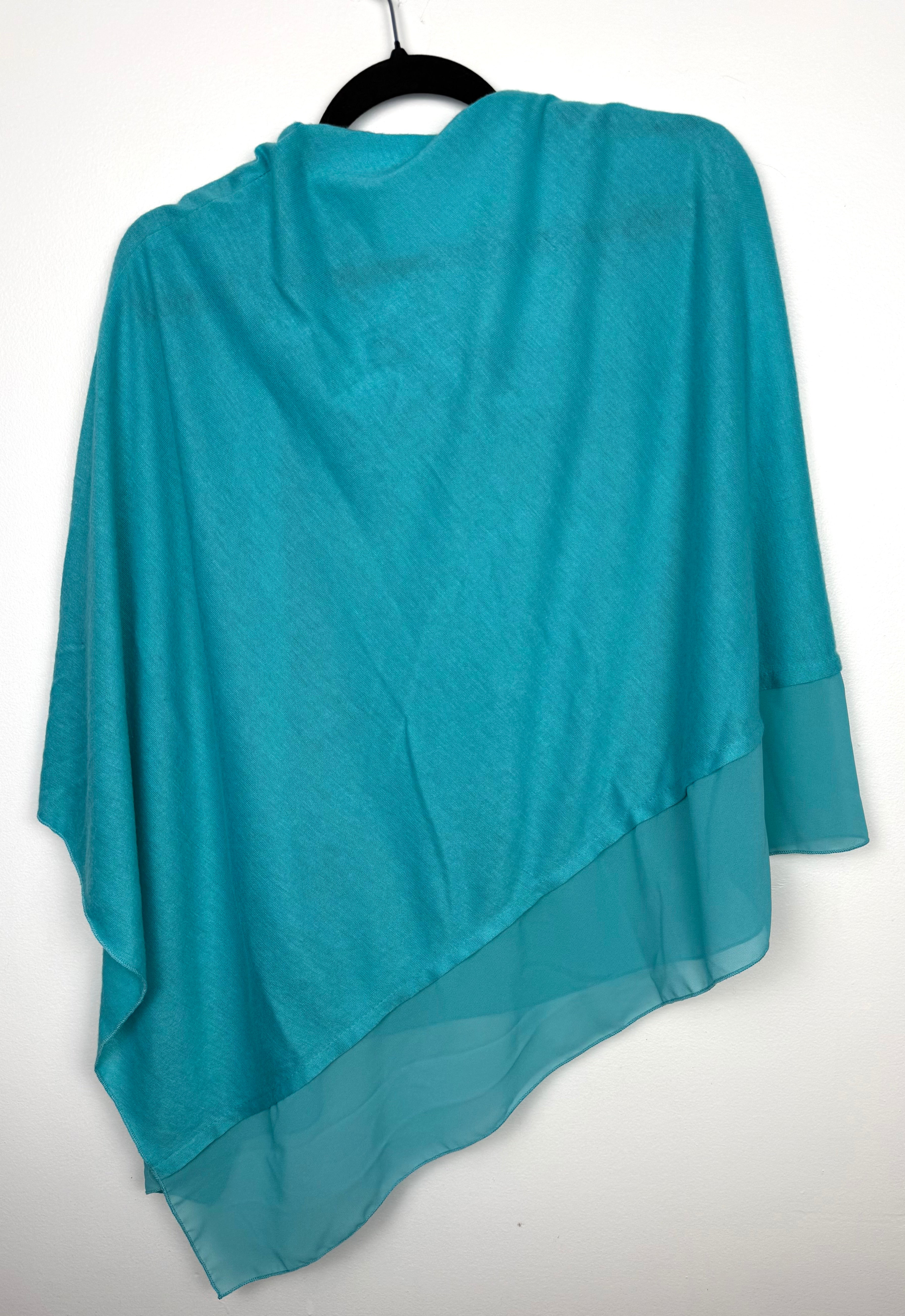 back of Teal Aqua Cowl Neck Poncho Wrap — Knit and Chiffon Contrast, One Size at Blue Sparrow Shop  on hanger