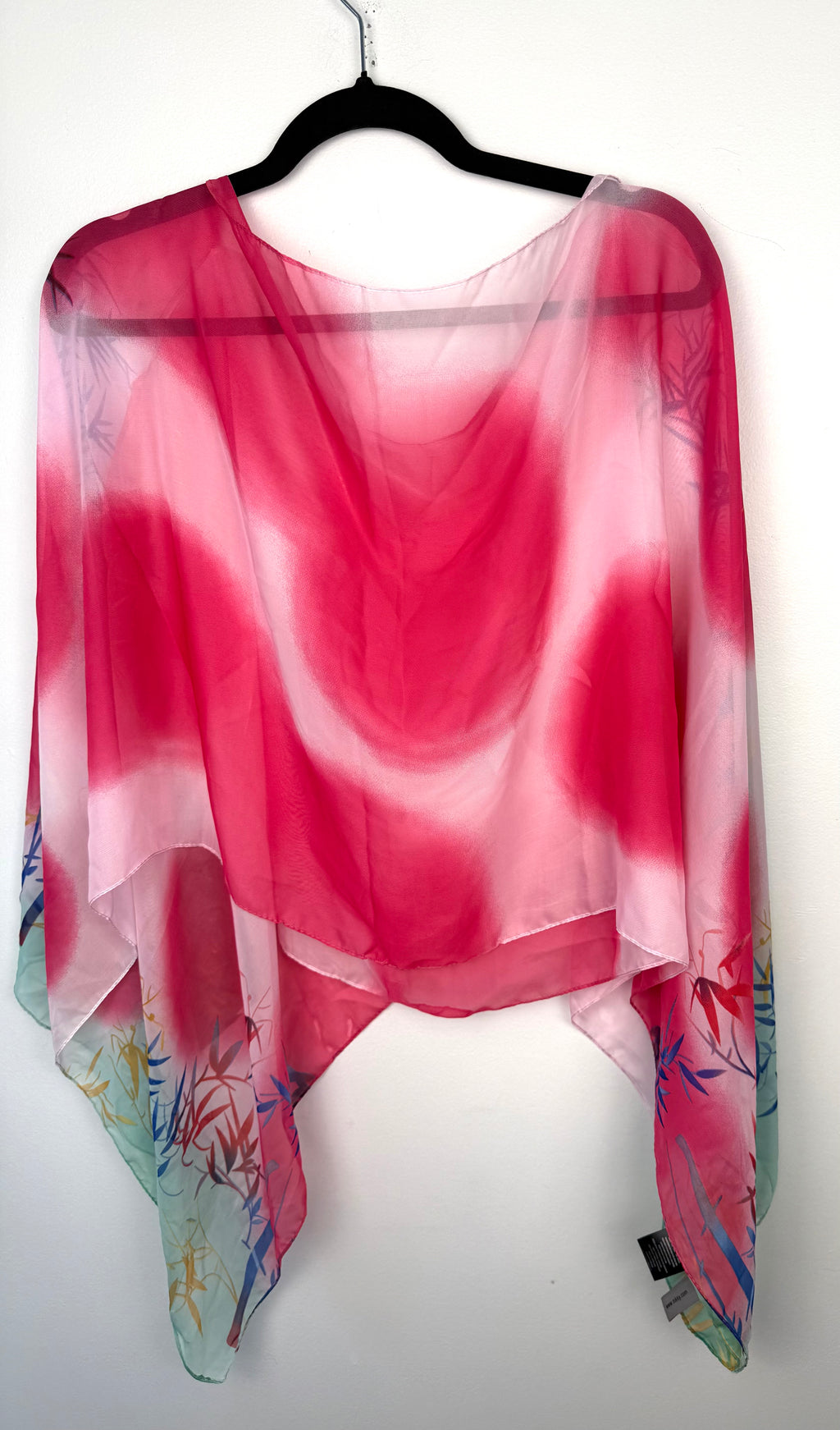 back of Tropical Sheer Wrap | Cover-Up | One Size at Blue Sparrow Shop on hanger