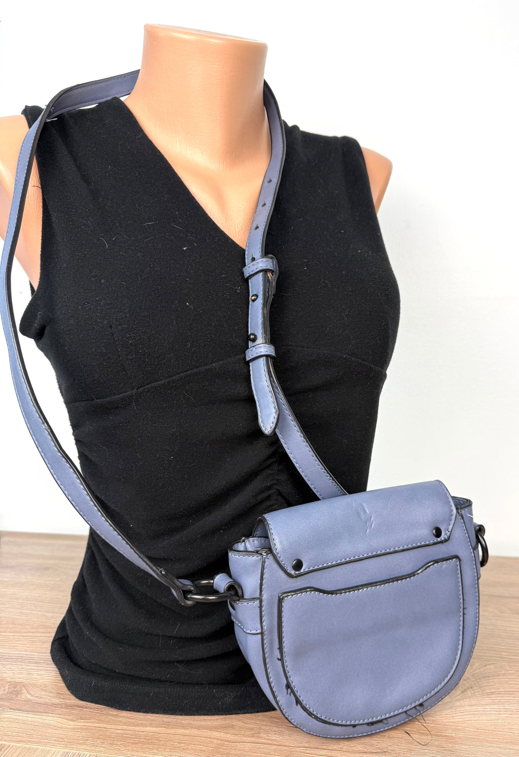 back of Vegan Leather Blue Grey Saddle Crossbody Bag at Blue Sparrow Shop  on mannequin to show size